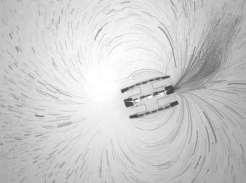 Researchers Create the World’s Smallest Fully Autonomous Robots 3 Tracer particle paths around a robot made of three motors